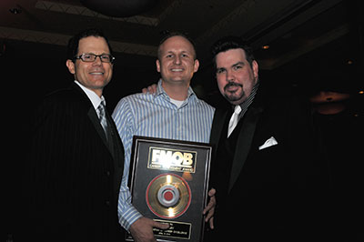 Erik Bradley receives his award from Bob Burke.