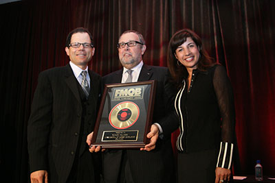 Richard Palmese accepts award from Sharon Dastur.