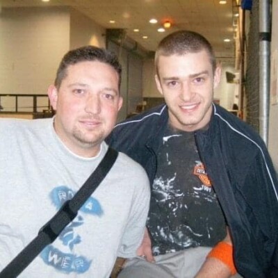 Backstage with Justin Timberlake in 2003. My blank stare is because I just realized that the batteries died on my mini-disc recorder midway through my interview with JT.